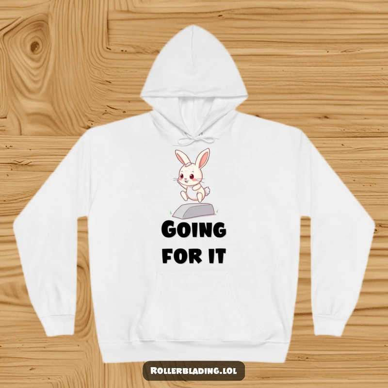 Funny curious bunny hoodie: A small bunny attempts a jump off a curb, embodying courage and offering a warm, humorous feel.